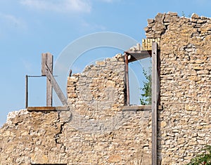 Old crumbling building in Elora Ontario, blue sky, window frames