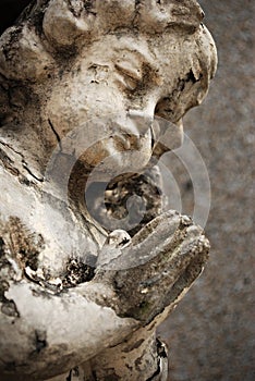 Old Crumbling Cherub Angel Statue photo