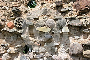 Old crumbling masonry wall with red bricks and stones.Old red brick wall, grunge background