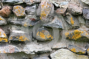 Old crumbling masonry wall with red bricks and stones.Old red brick wall, grunge background