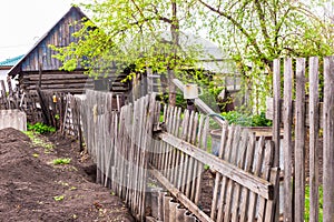 old crumbling wooden picket fence