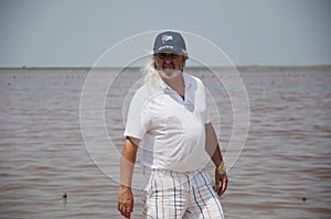 old cuban man in cap at beach. senior grizzled man with long gray hair on the island of freedom