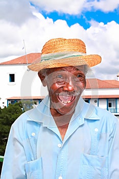 Old cuban man with straw hat make a funny face