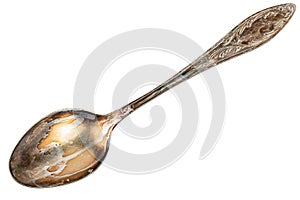 Old cupronickel spoon with visible oxidation layer isolated on white background