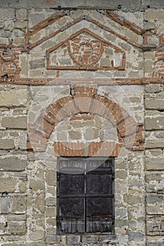 Old curly brickwork, red brick on gray