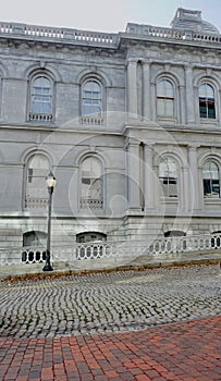 Old Customs House in Portland, Maine, side view with cobblestone street