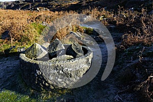 Old cylindrical gritstone object on the slopes of Burbage Edge