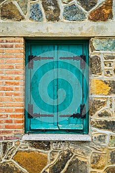 Old cypriot house with blue window