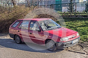 Old Czechoslovak hatchback red car Skoda Favorit right and front view