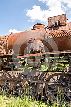 Old Czechoslovakian CSD steam engine on graveyard, rusty, boiler detail