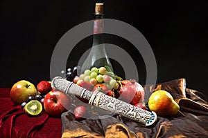 Old dagger in the scabbard, classic Dutch still life with dusty bottle of wine and fruits on a dark blue background, horizontal