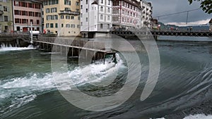 Old dam Nadelwehr in the center of the old town of Lucerne on the Reuss river, Switzerland