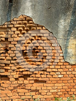 Old damaged abandoned brick wall