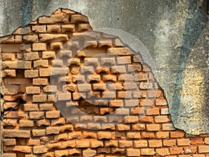 Old damaged abandoned brick wall