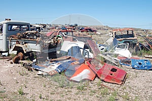 Old damaged cars in the junkyard. Car graveyard