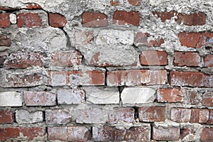 An old, damaged, ceramic, red, brick wall with a crack. Background for your design.