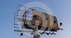 Old damaged decommissioned wooden advertising board