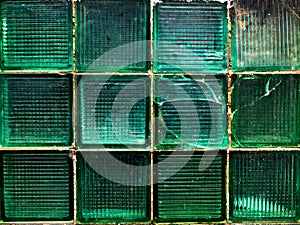 Green wall made of square green glass pieces background, texture, pattern