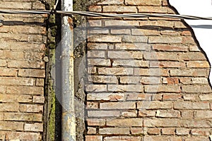 Old damaged gutter of an abandoned house