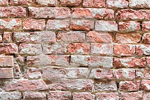 Old damaged red brick wall