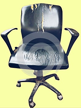 Old damaged used black dirty office chair officechair with rolling casters wheels and torne leather photo view image