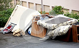 Old damaged and useless house supplies abandoned in the street