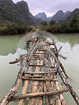 Old dangerous abandonned bamboo bridge crossing a river in the  Trung Khan District, Cao Bang Province, Vietnam