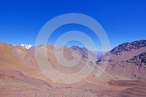 Old dangerous mountain road of the Paso de la Cumbre or Cristo Redentor in the Andes between Argentina and Chile photo