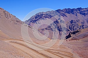 Old dangerous mountain road of the Paso de la Cumbre or Cristo Redentor in the Andes between Argentina and Chile photo