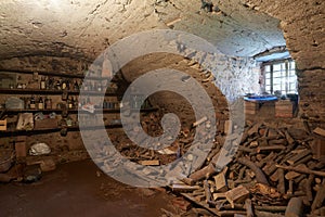 Old, dark basement with wood pile interior