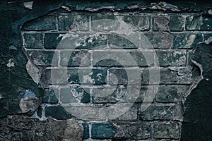 Old dark ramshackle brick wall - grunge background