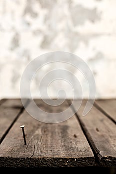 Old dark shabby boards with rusty nails.