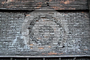 Old, dark, vintage, shabby, charred brick wall, abstract industrial background
