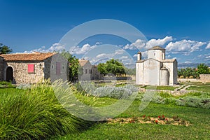 Old, dated on 9th century, Church of the Holy Cross in Nin with Dinaric Alps in background