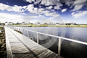 Old Days Pond boardwalk with East Coast homes in Bonavista Newfoundland Canada