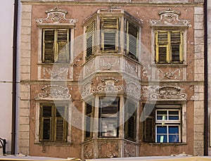 Old decorated facade and shutters, Bolzano Italy photo