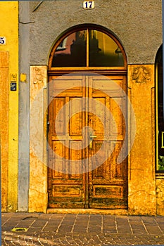 Old decorated wood door and shutters, Bolzano, South Tyrol Italy photo