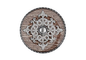 Old decorated wooden round shield isolated on white