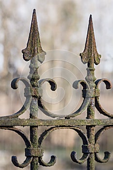 Old decorative rusted wrought-iron fence
