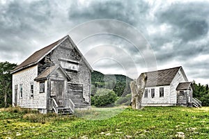 Old decrepit buildings in the country with dramatic sky