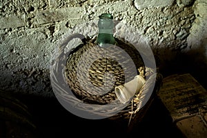 Old demijohn with mature red wine