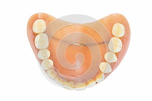 Old dentures isolated on white background