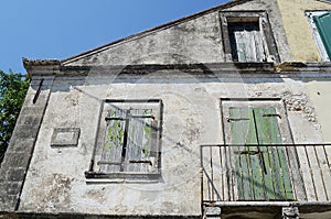 Old derelict building with shutters on window, Assos, kefalonia,Greece