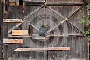 Old derelict cracked farm barn wooden door