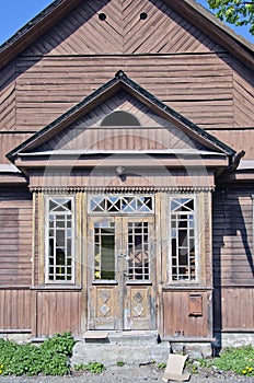 Old derelict wooden house facade