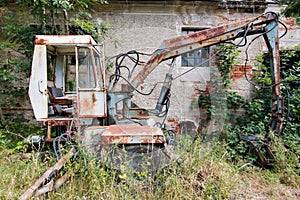 Old deserted and broken digger