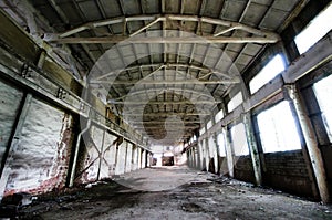 Old and deserted plant symmetrical interior