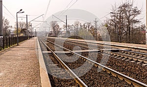 Old deserted railway peron. Abandoned station in harming quarantine and lockdown