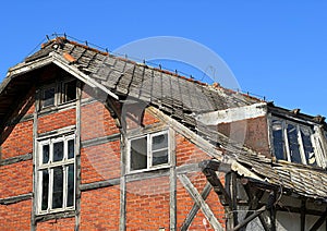 Old desolate red brick house, ruin and out of use architecture