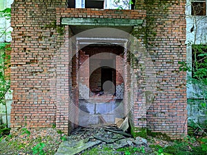 old and destroyed brick building in the forest.